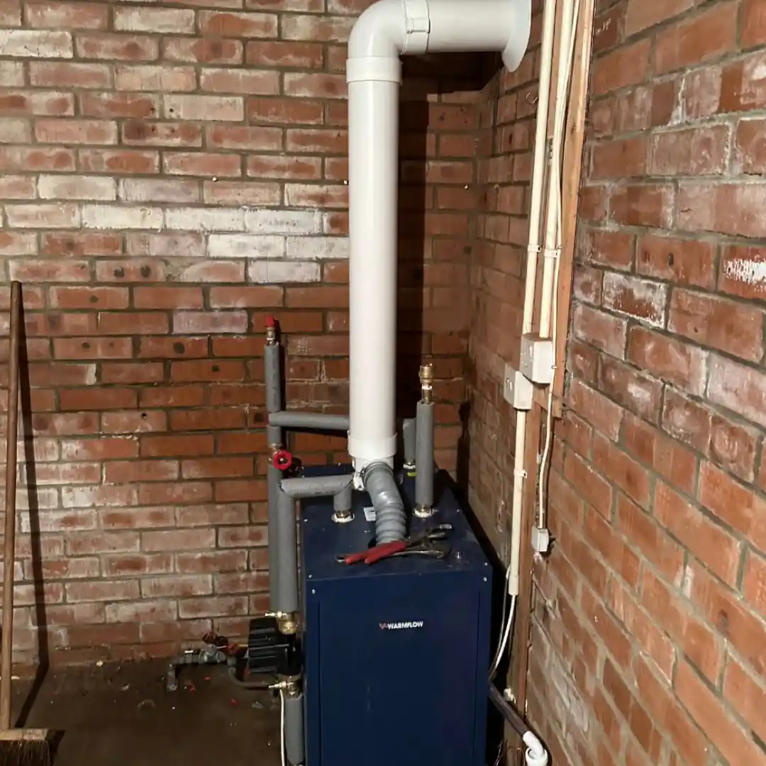 Heating system against brick wall